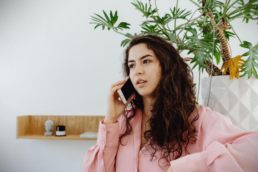 Woman in Ottawa having a free 15-minute therapy consultation over the phone.