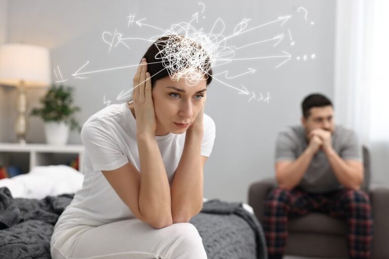 Anxiety Therapy. A worried woman and a man at home. Confused thoughts as doodles coming out of her head. Stress, anxiety, depression.