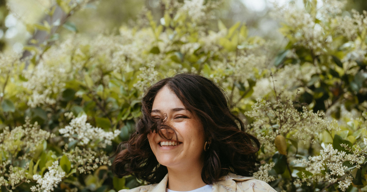 Smiling woman outdoors representing CBT therapy in Westboro, Ottawa